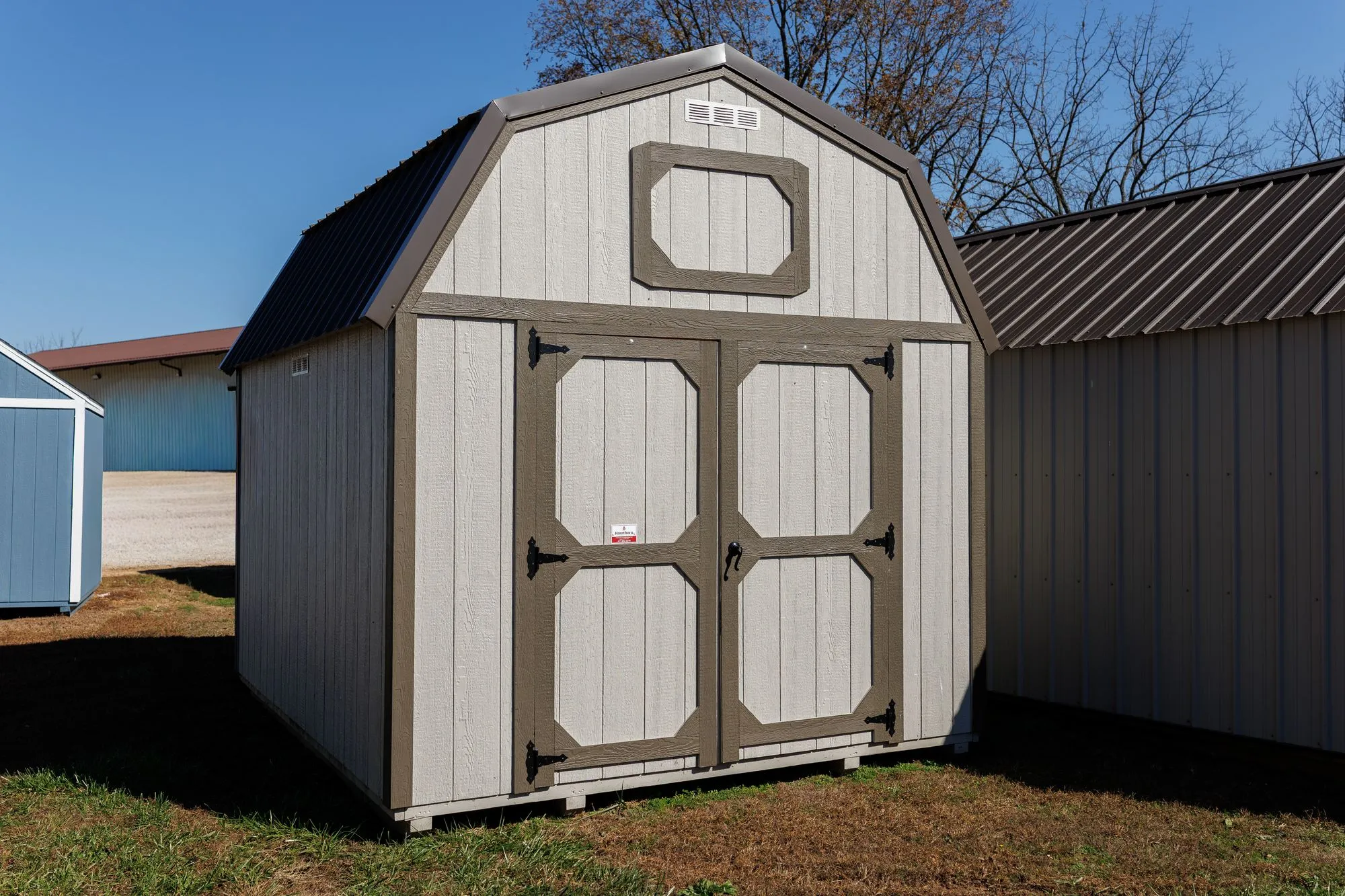 Lofted Barn with light gray siding, clay-gray trim, charcoal roof